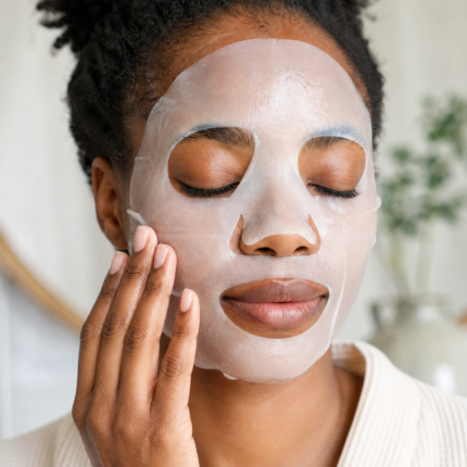 Applying a hyaluronic acid sheet mask for calm, hydrated skin